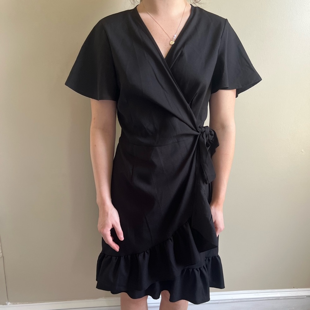 New with tags. Black wrap dress.